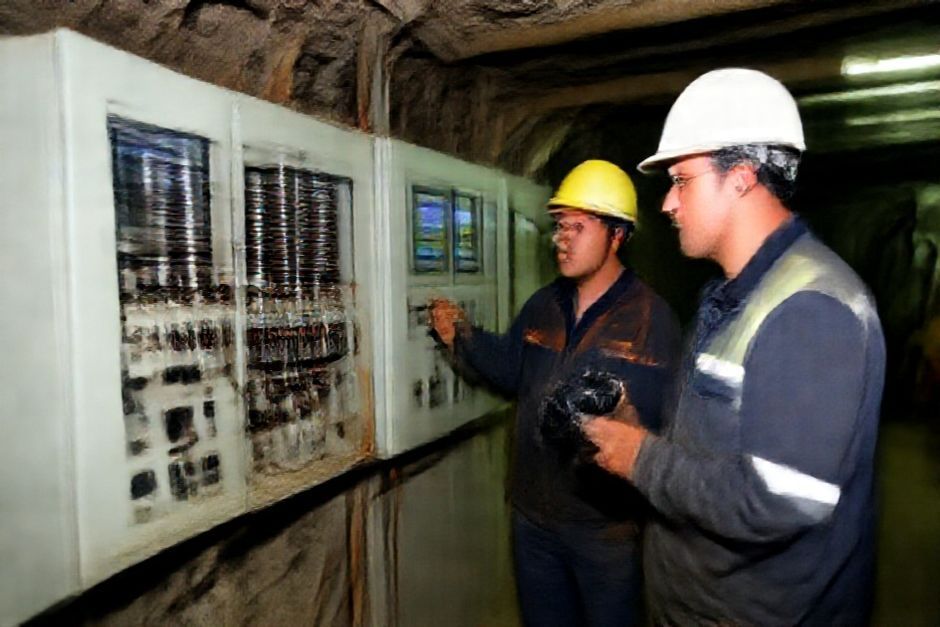 A mining engineer inspects the electrical systems and control panels of an underground gold mining operation in Los Angeles.